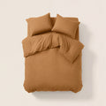 Sateen Bedding Set - Desert Sand on a bed, featuring a modern beige color for a stylish and intentional look.